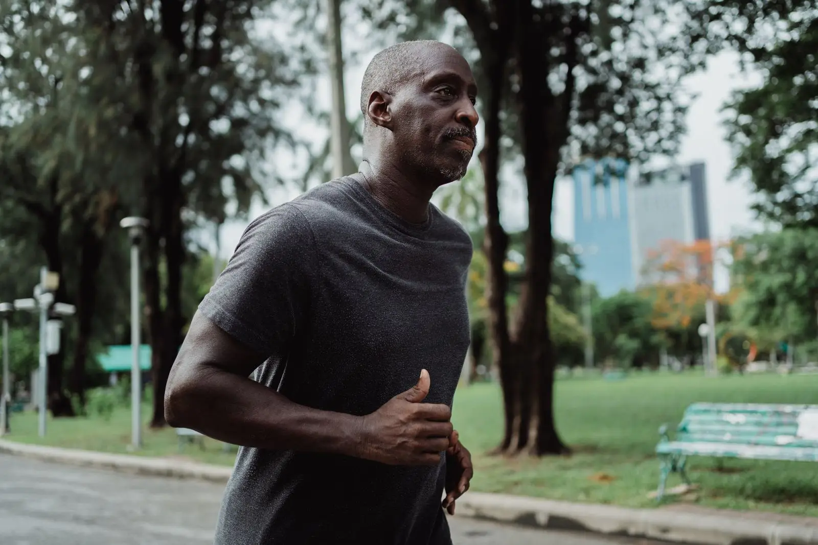 Man jogging in a city park for a healthy lifestyle