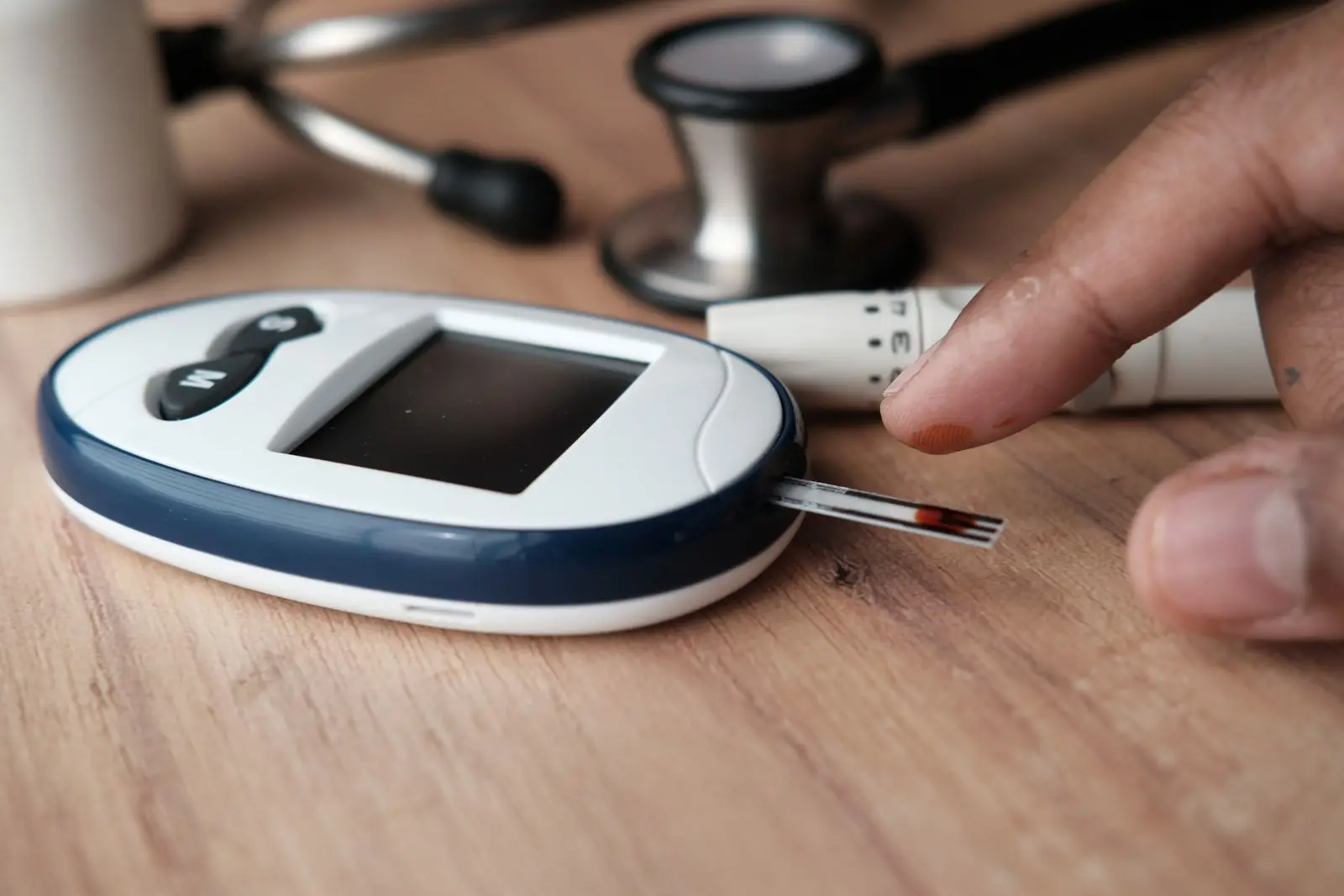 Glucometer and finger-pricking device for checking blood sugar
