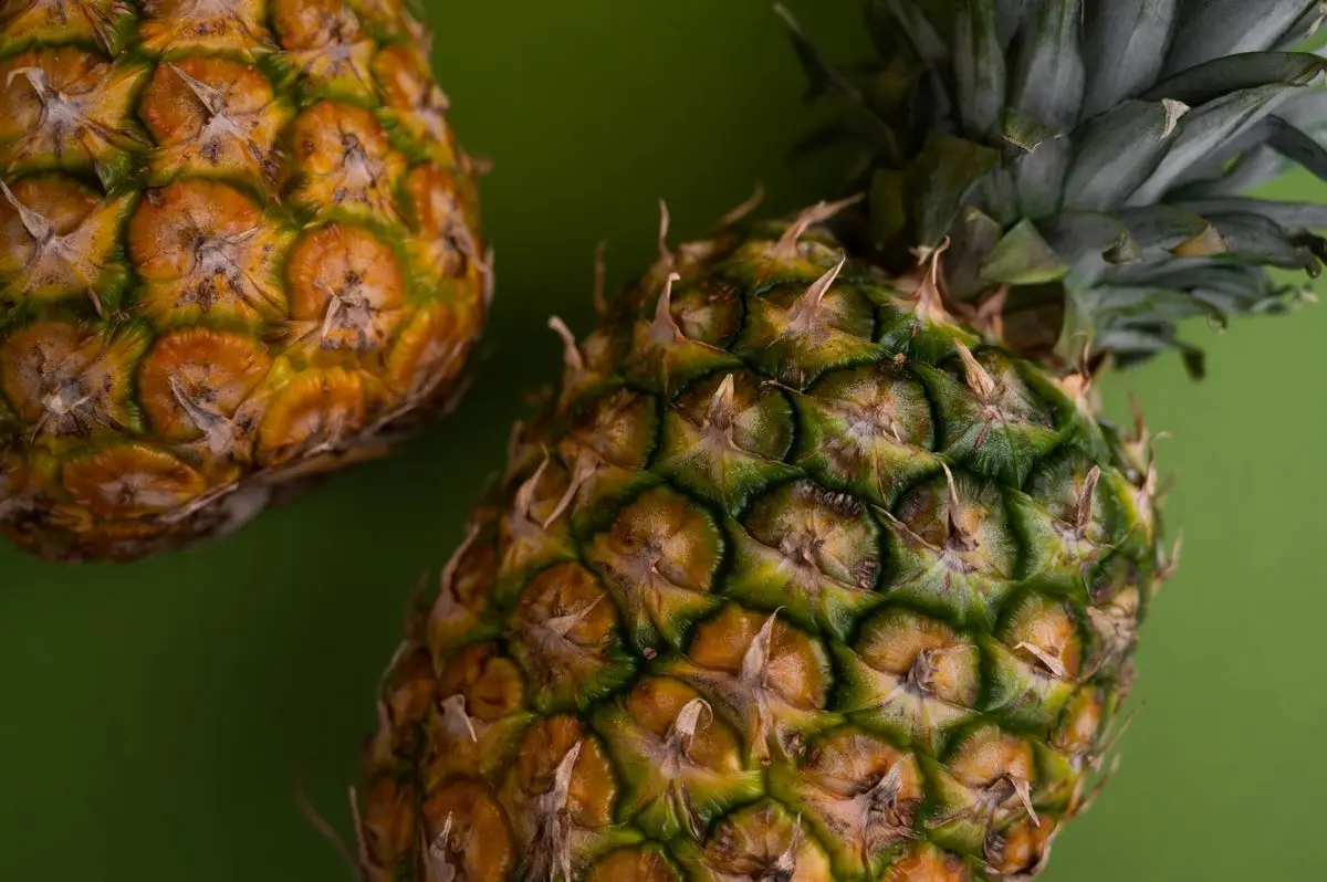 Whole ripe pineapples with green crowns, about the size of your baby at 33 weeks pregnant